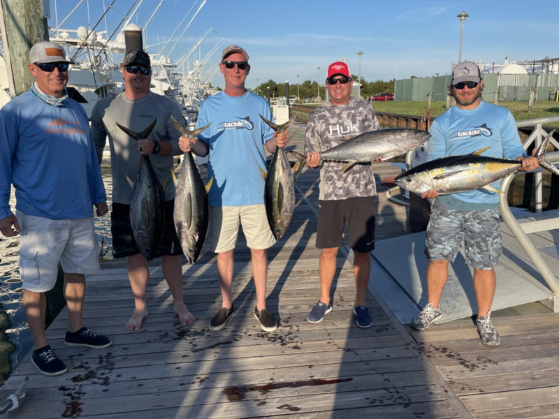 Tuna anglers with their fish