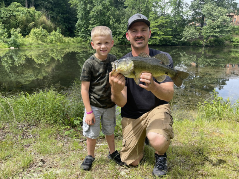 kid caught a huge largemouth bass