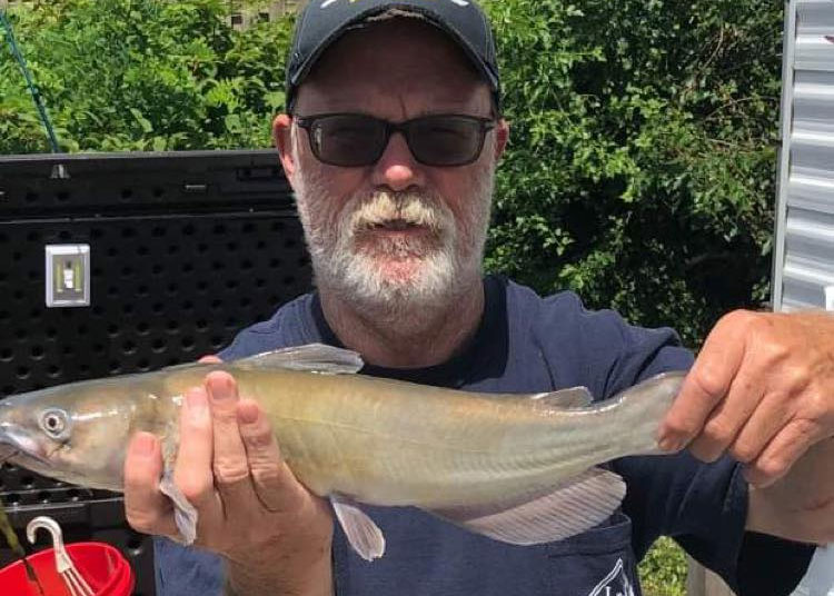 angler with a catfish