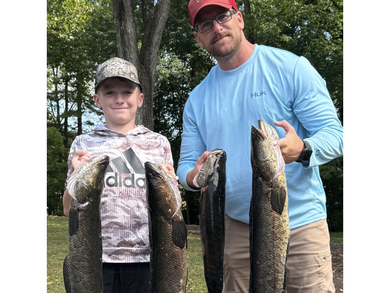 anglers with snakehead fish