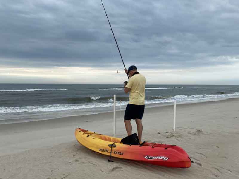 kayak fishing for sharks from the beach