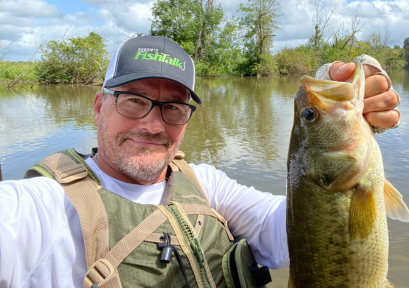 angler caught bass on bed