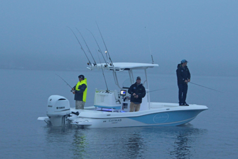 anglers fishing from a caymas 26 hb