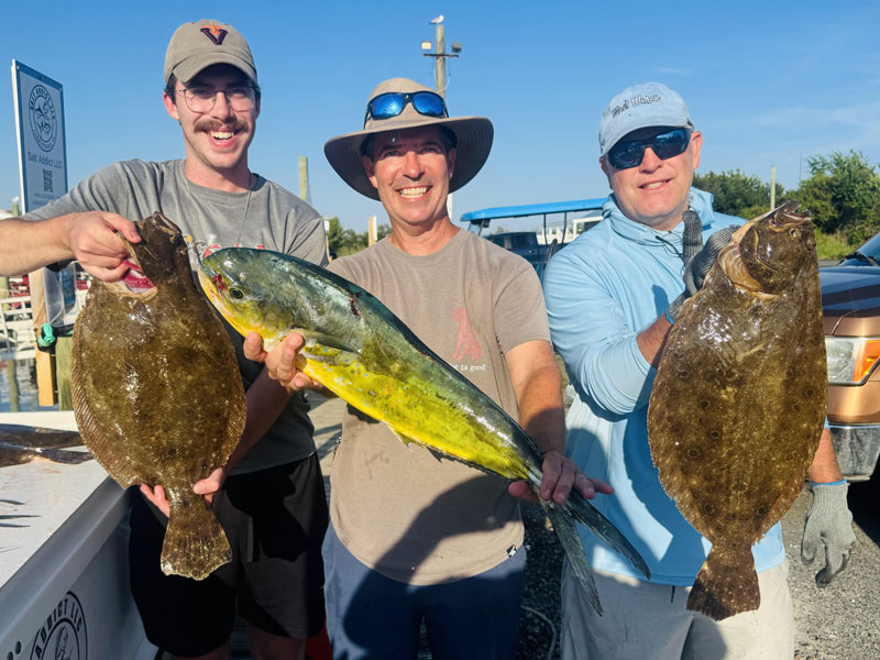 anglers with mahi and flounder