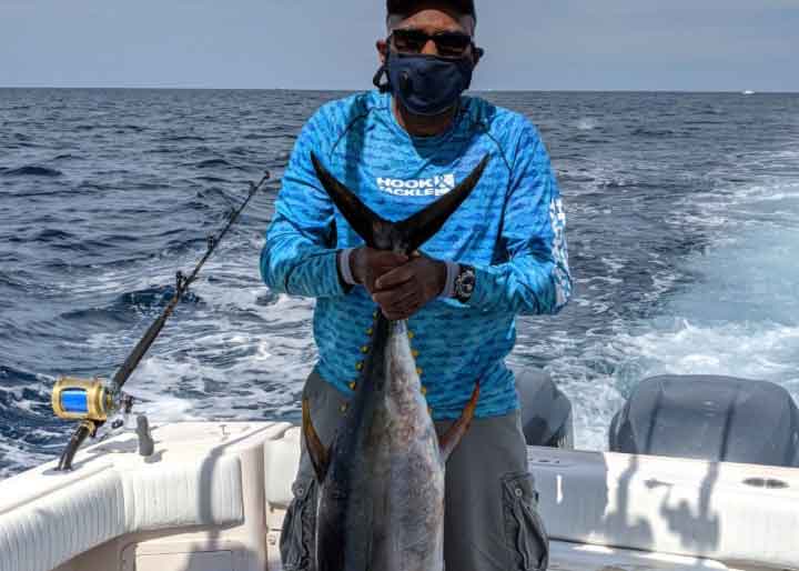 angler with tuna