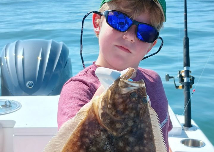 angler with a flounder