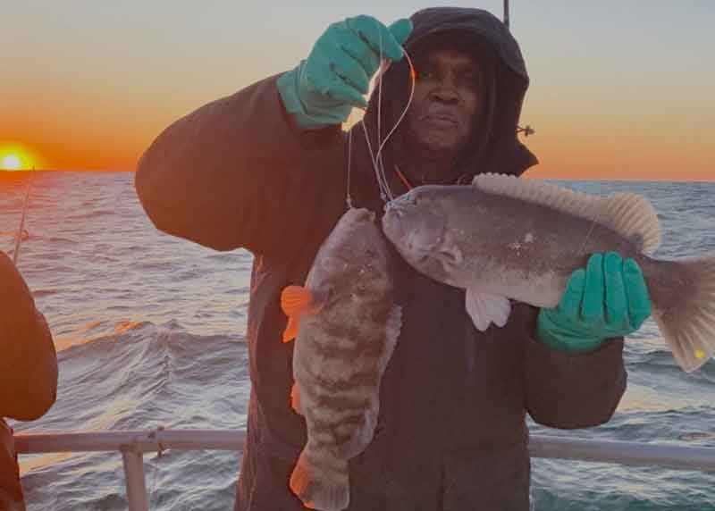 angler with tautog catch