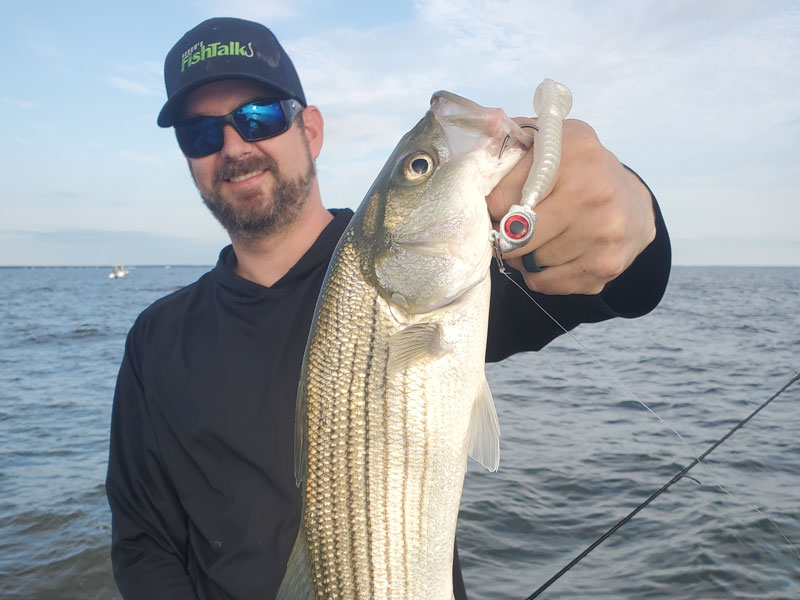 angler with fishing rod and rockfish