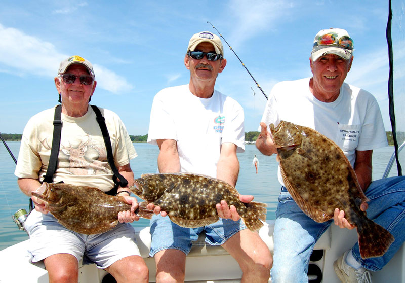 anglers with a catch of flounder