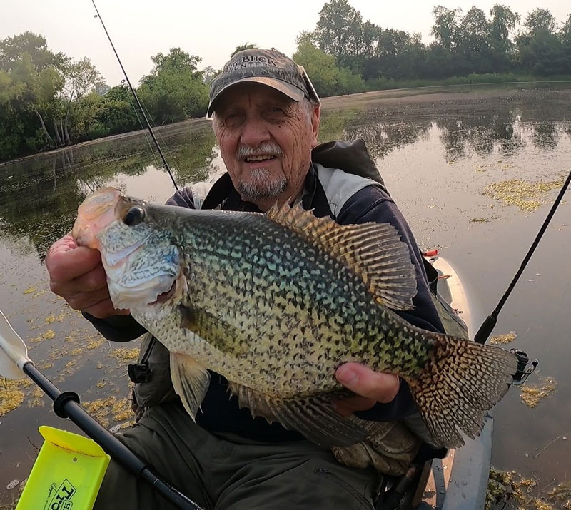 fisherman with a big crappie fish