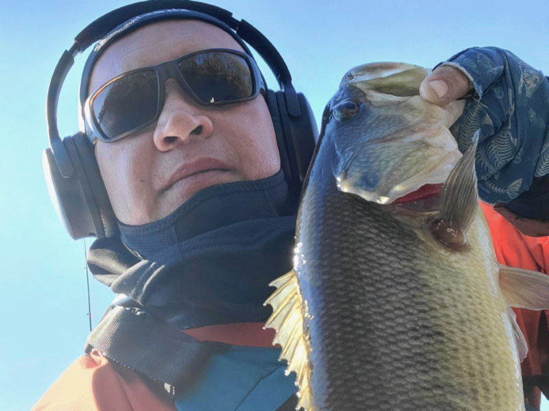 angler with a winter bass