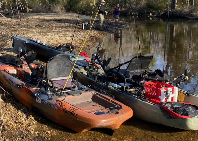 kayaks on riverbank