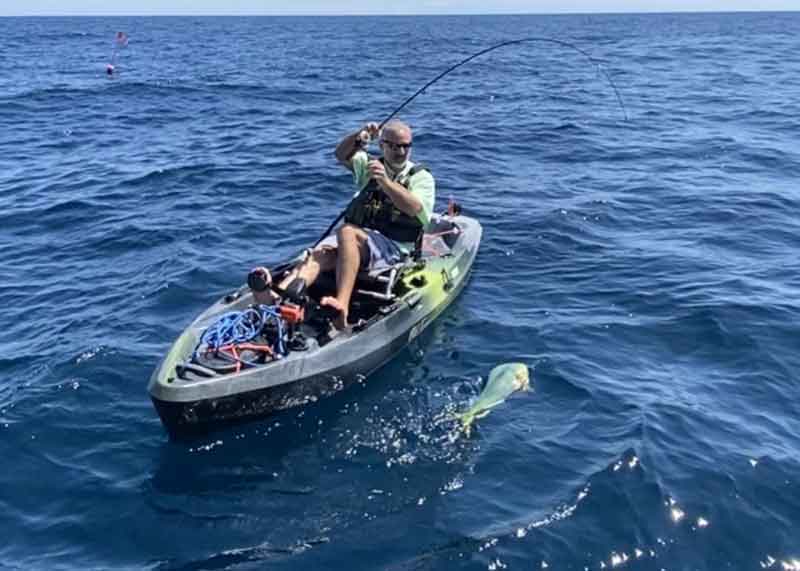 catching a dolphinfish on a kayak