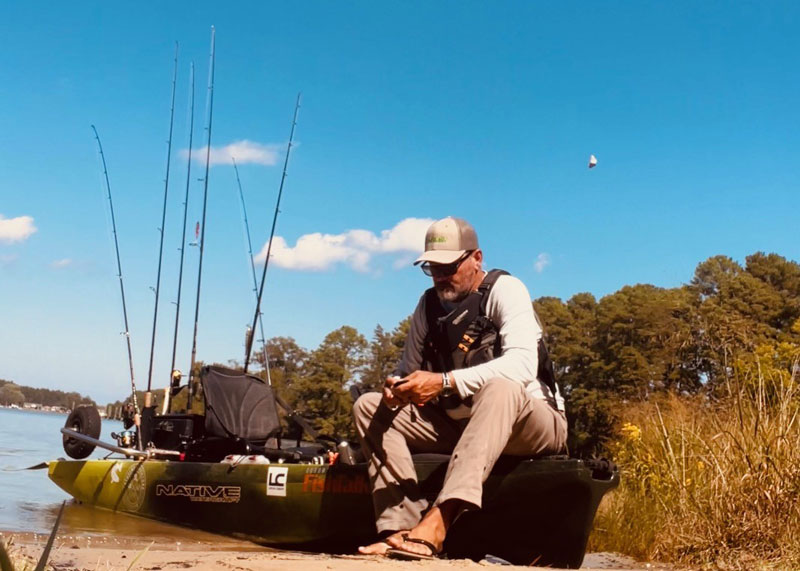 angler taking a break while kayak fishing