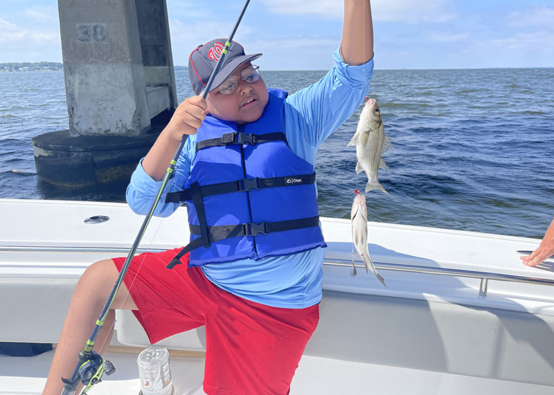 kid fishing for perch on the chesapeake bay