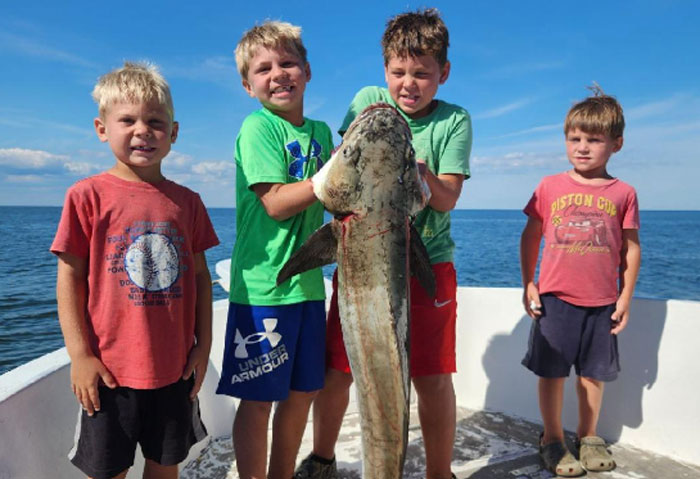 kids with a big cobia