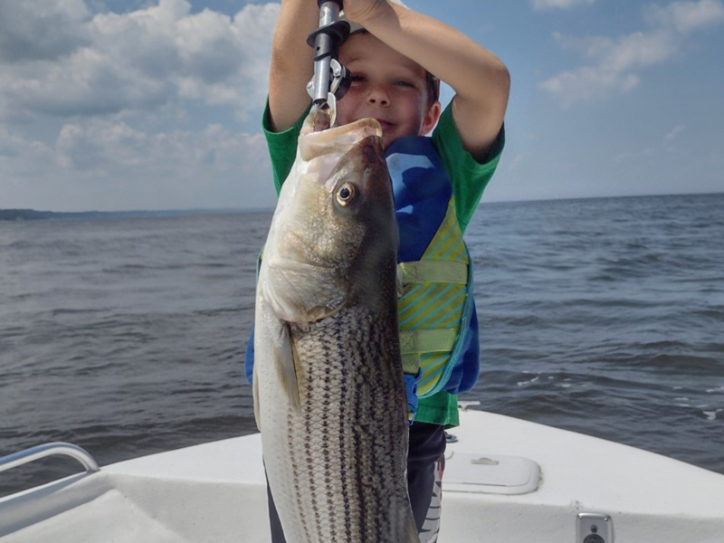 kid with a rockfish