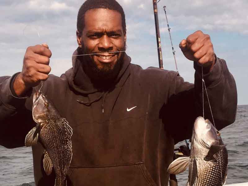 an angler with sea bass