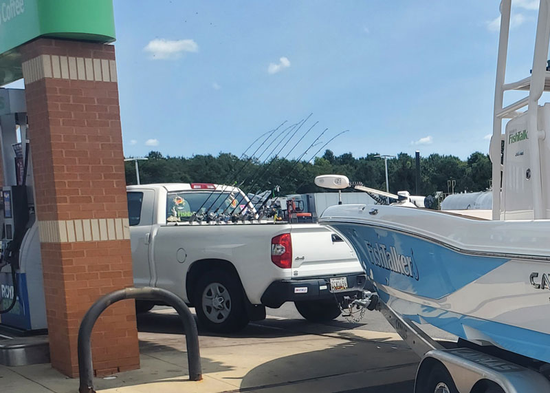 pickup truck with fishing rod racks in the bed