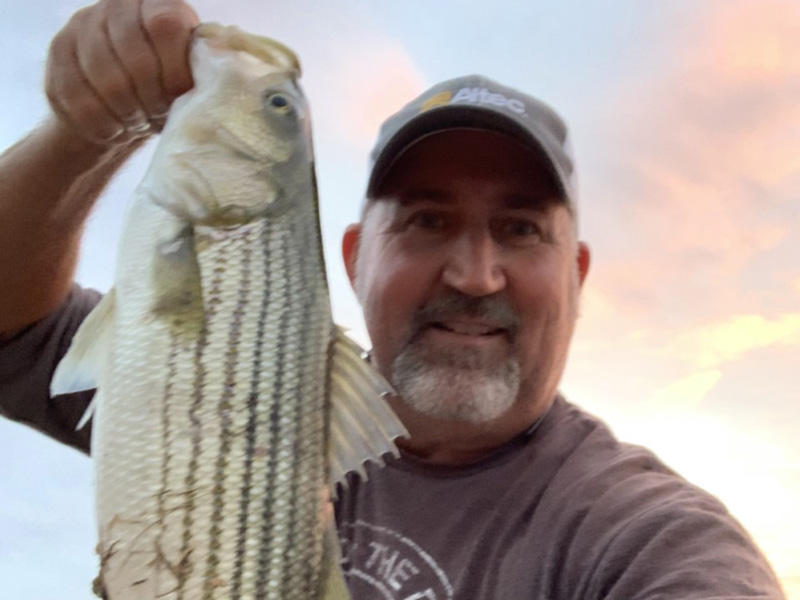 angler fishing north bay with a striper