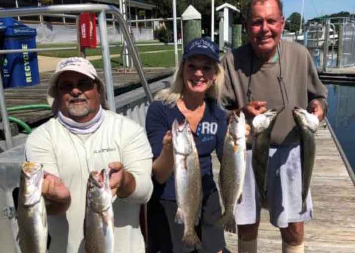 anglers with speckled trout