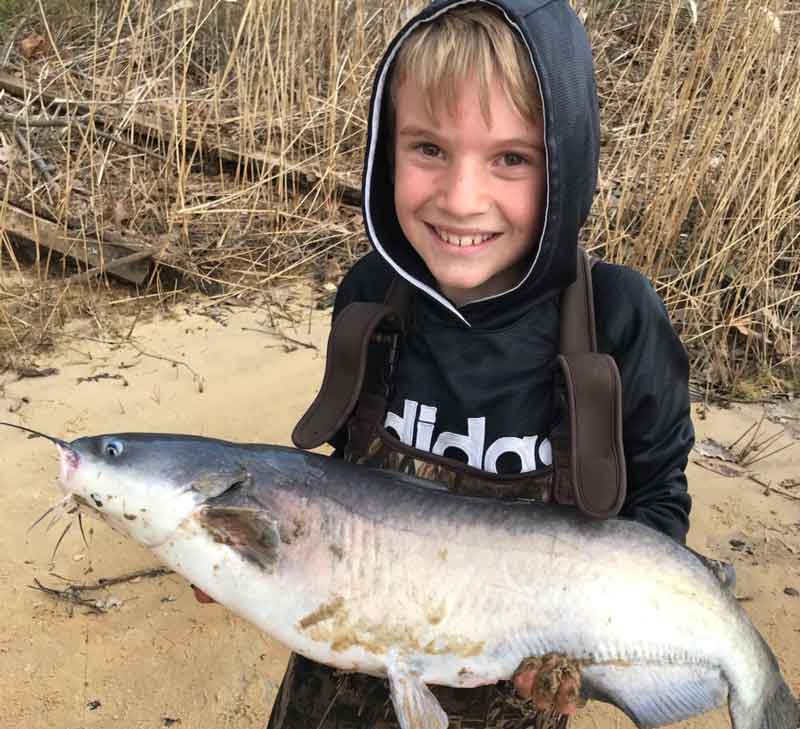 kid with a big catfish