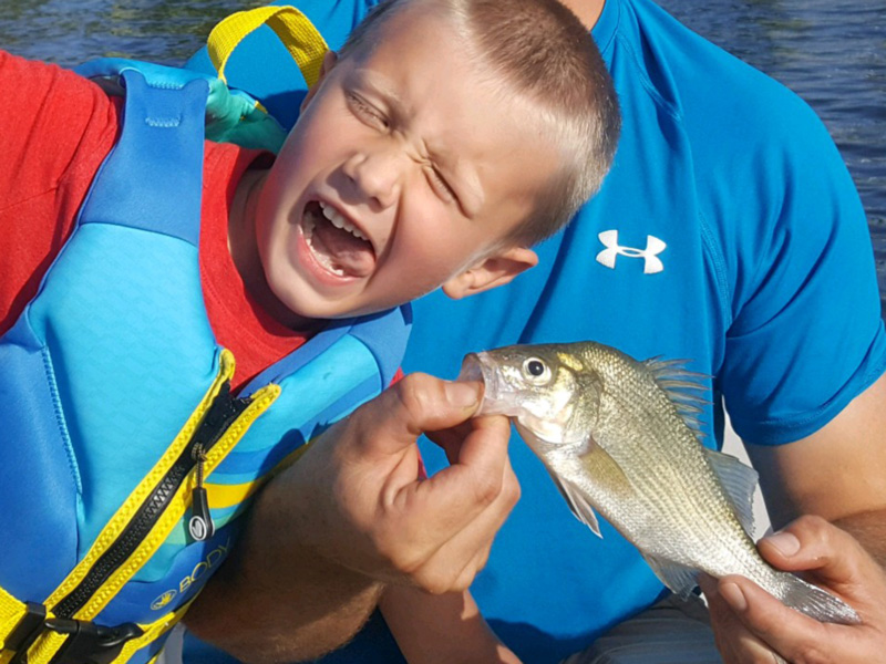 kid caught a white perch