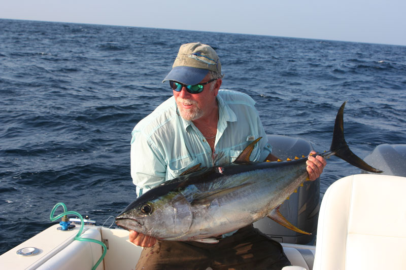 angler with a yellowfin tuna