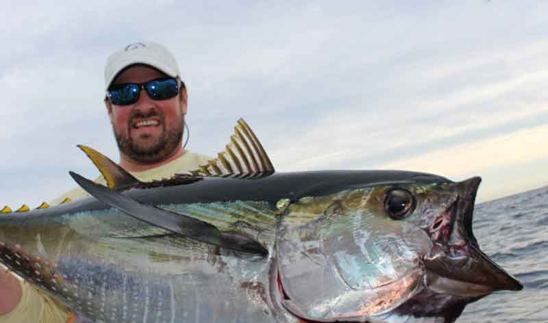 man caught a yellowfin tuna