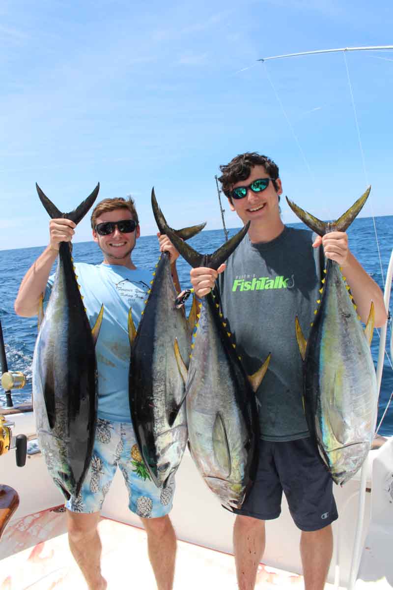 boys with big yellowfin tuna they caught